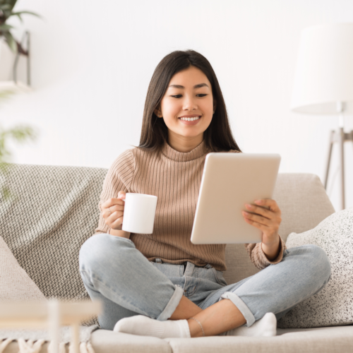 Girl using a tablet to read an ebook, representing digital education and online book access